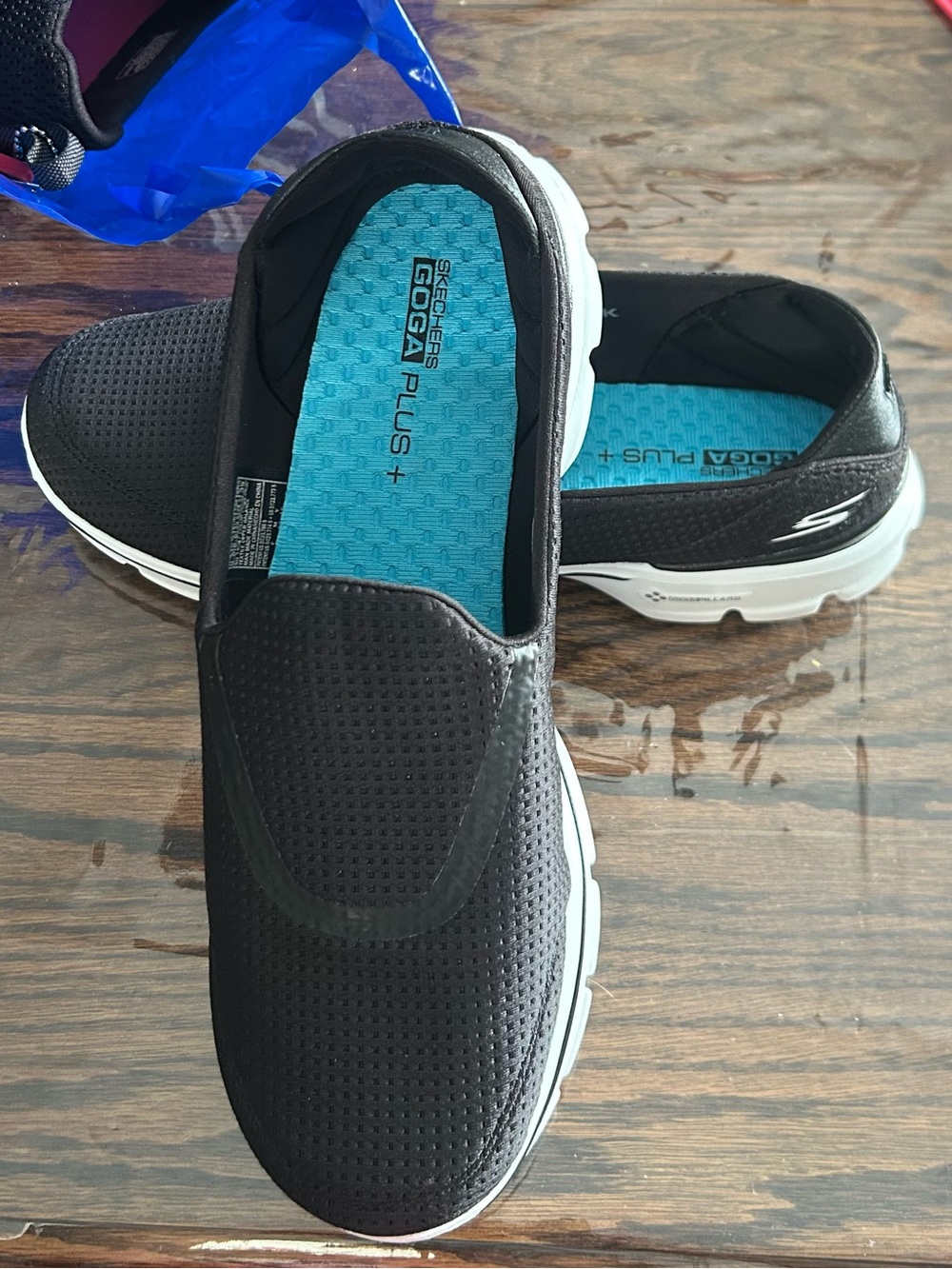 Skechers woman’s Black Slip-On Loafers with Blue Insoles
